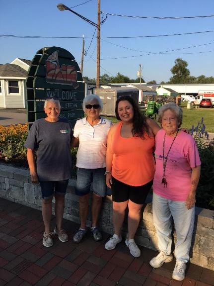 A group of people posing for a photo

Description automatically generated with medium confidence