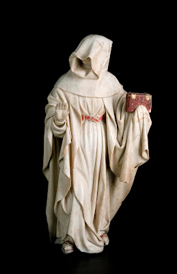 Jean de la Huerta and Antoine le Moiturier, Mourner with Cowl Pulled Down, Right Hand Raised, Left Hand Holding a Book in a Flap of His Cloak, no. 78, 1443–56/57, Musée des Beaux-Arts, Dijon