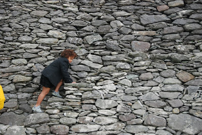 Climbing the wall, Staigue Fort, Ireland