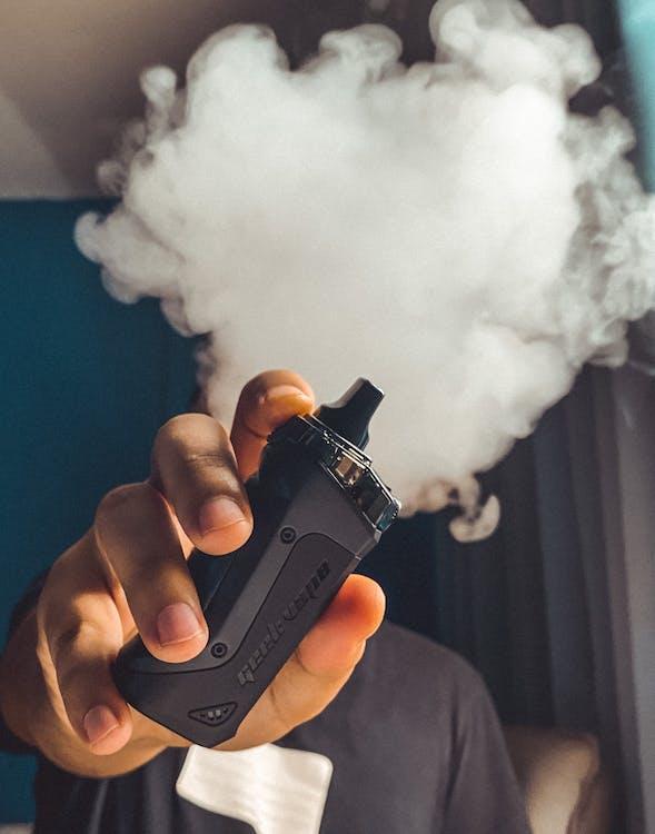 https://www.pexels.com/photo/person-holding-black-vape-3545426/