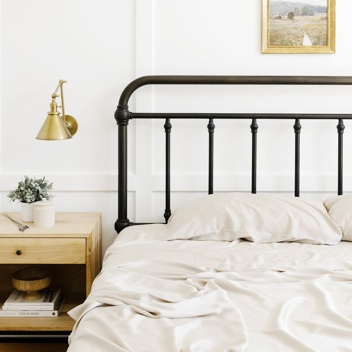 Bed with cream-colored sheets