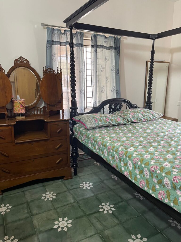 Prameela Nair's Palakkad Home | Athangundi Tiles with wooden furniture in the bedroom