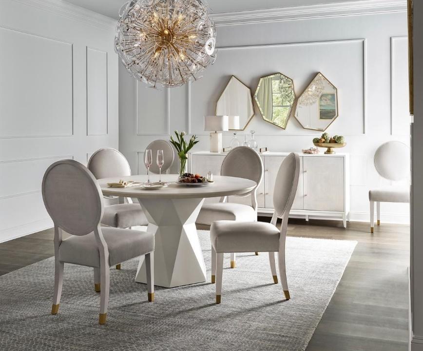a dining room with modern mirrors