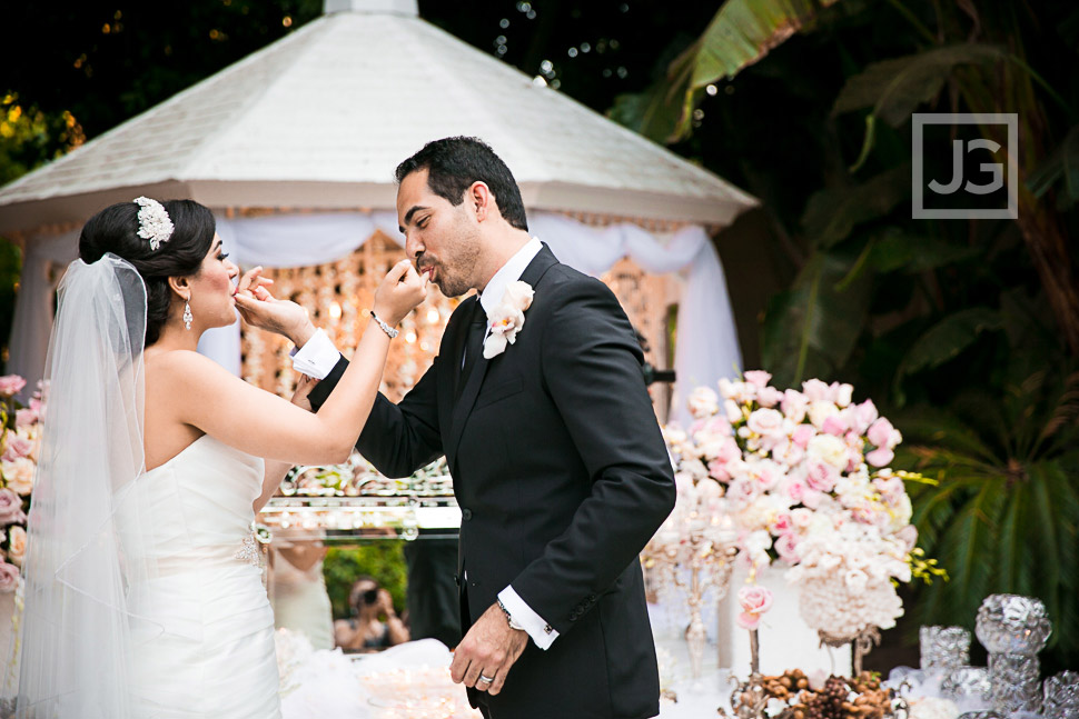 Persian bride and groom feeding each other honey. 