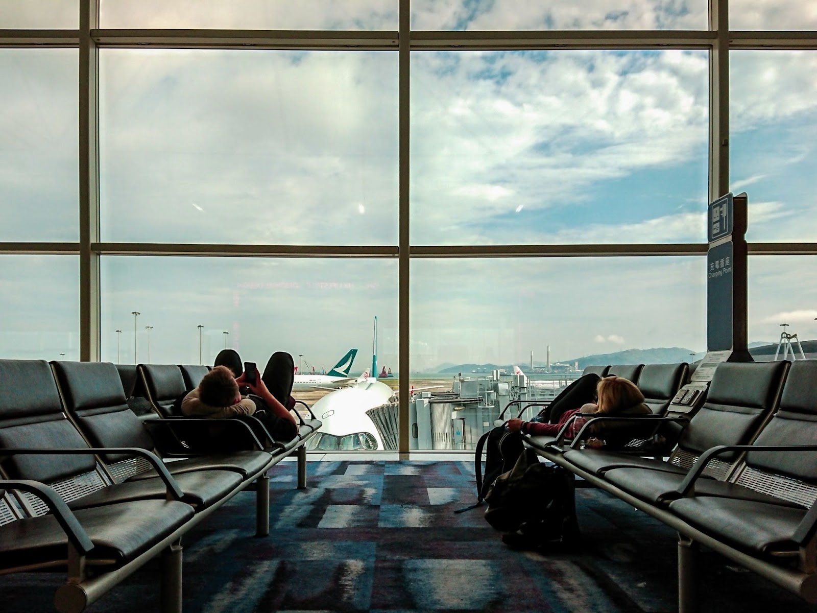 Young couple chilling at the airport