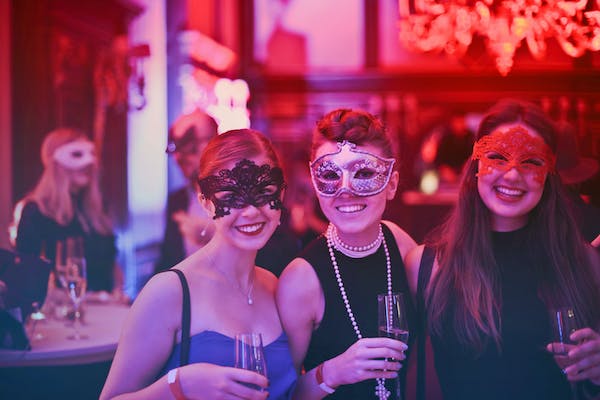 Guest wearing mask at a themed party