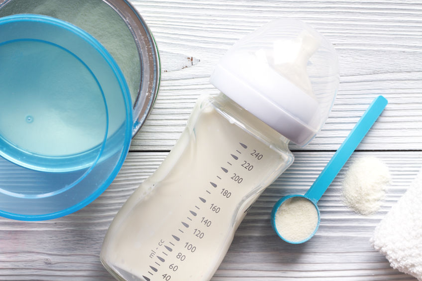 best european baby formula prepared in a bottle, against a white background
