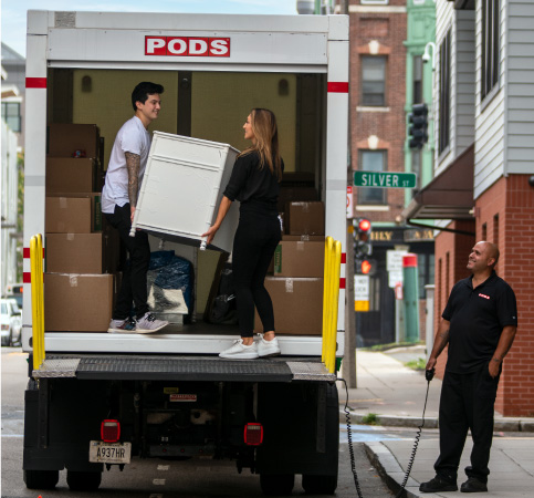 A solo mover enlists moving help to unload her PODS container using City Service.
