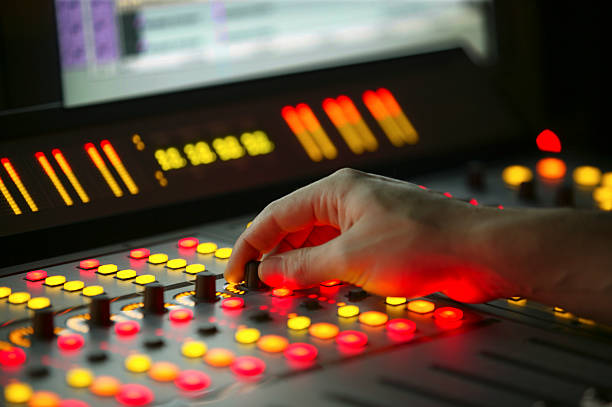 Male hand on control Film Mixing console  video editing stock pictures, royalty-free photos & images