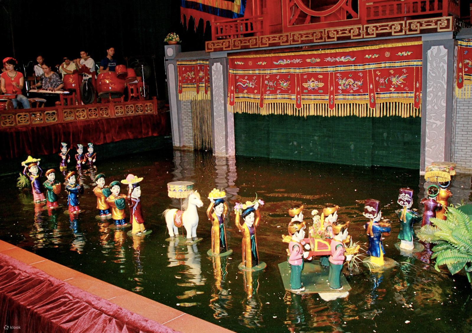 Watch a water puppet show in Vietnam with kids