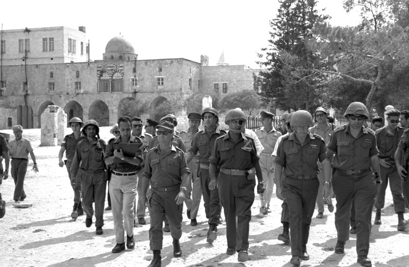  ‘STATUS QUO’ creator: Defense minister Moshe Dayan (2nd from L.)  walks through the Old City during the Six Day War, 1967, accompanied by chief of staff Yitzhak Rabin, Gen. Rehavam Ze’evi and Gen. Uzi Narkiss. (credit: GPO FLICKR)