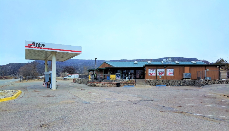 Photo of the Real Estate & Business for Sale at 1410 NM 68 in New Mexico. Shows gas station and front view of building.