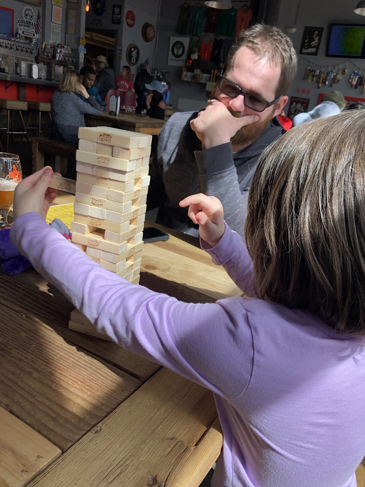 father and daughter playing jenga in Golden Colorado
