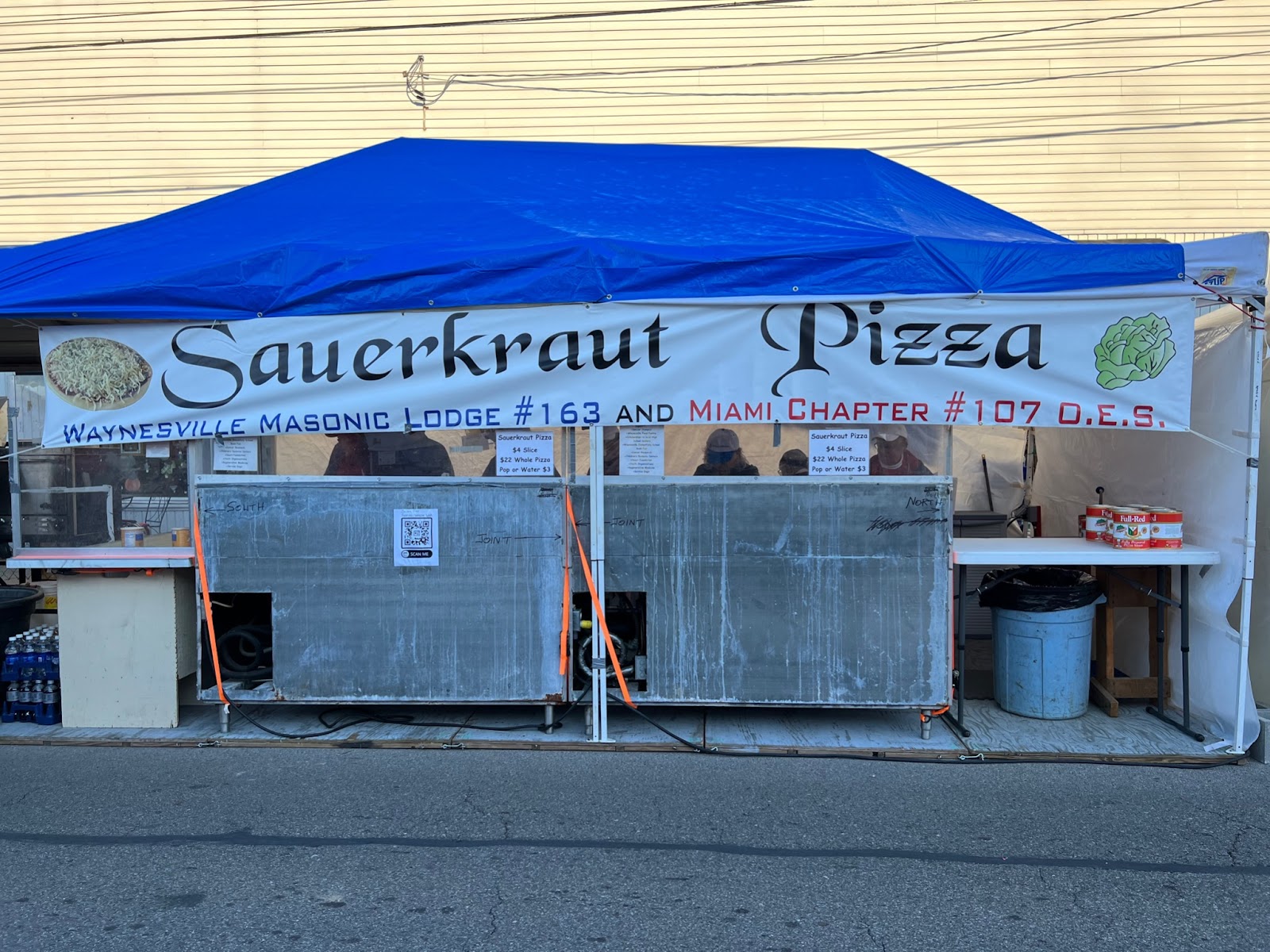 Image of a sauerkraut pizza stand at the Waynesville Sauerkraut festival.