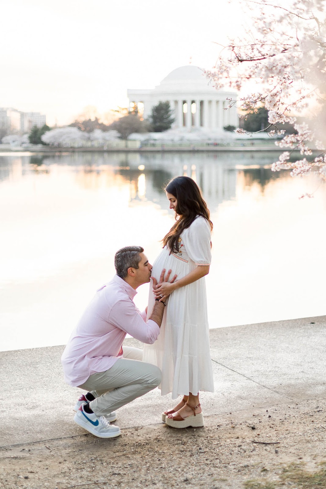 Husband kissing pregnant wife's belly