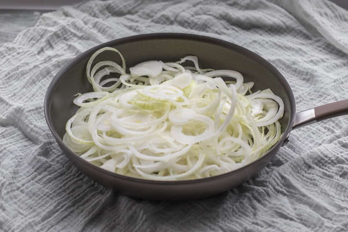 pile of onions in a pan