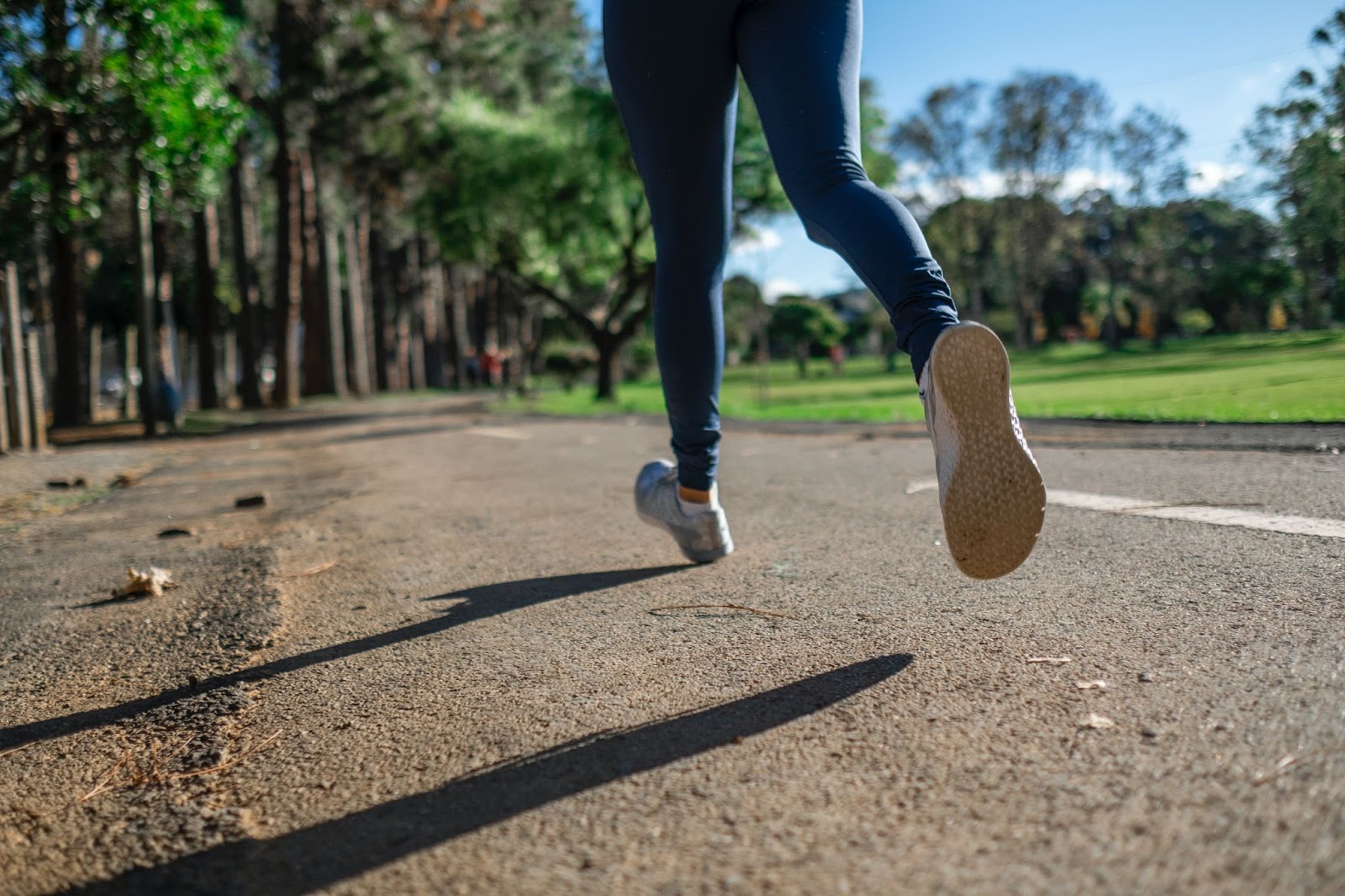 closeup of runner's feet and legs in action