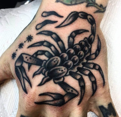 Scorpion tattoo on hand