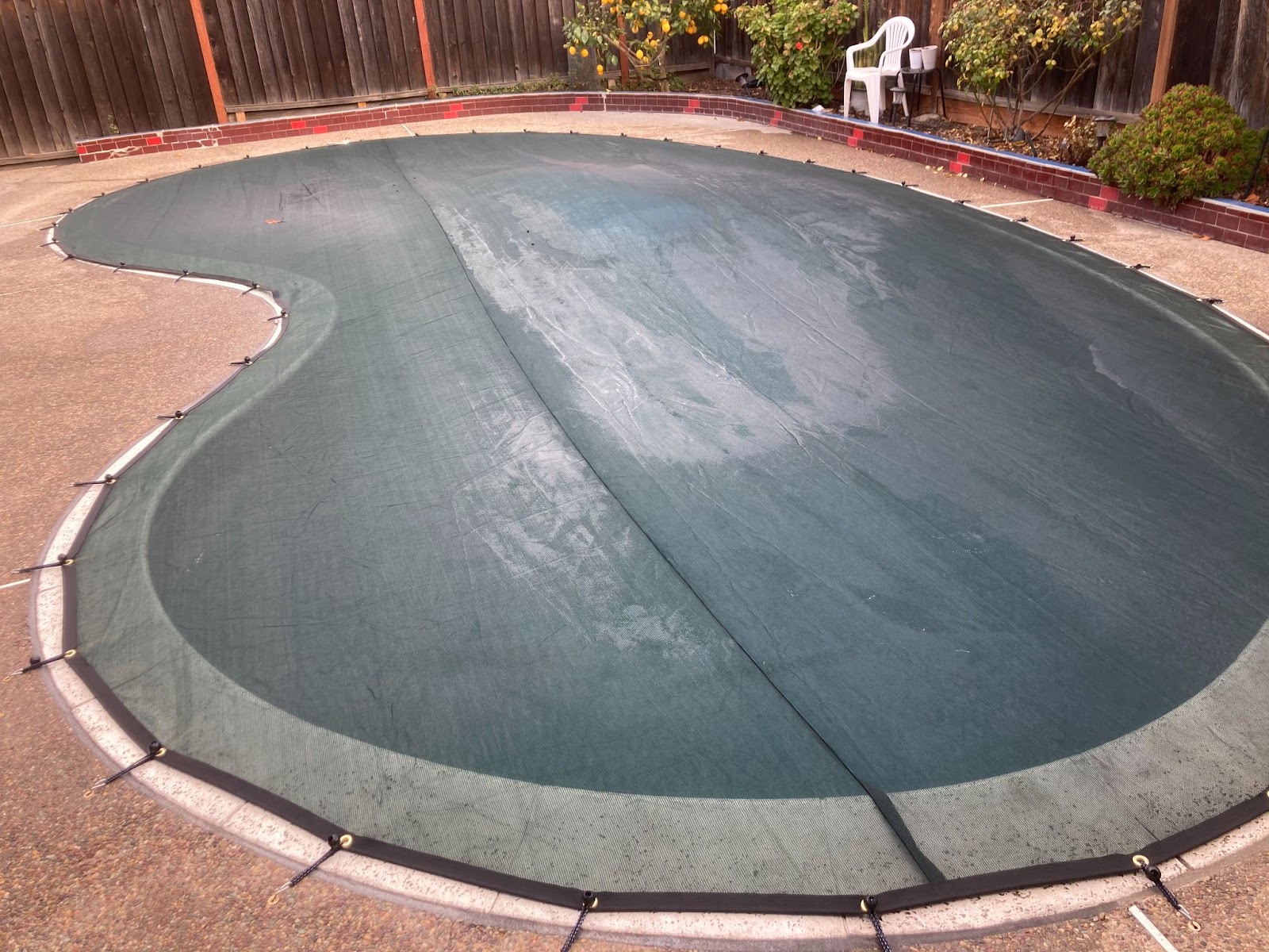 Installed mesh swimming pool cover