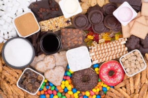 Photograph of sugary foods including donuts, brownies, and chocolates, from "Green Smoothies for Diabetes" at Green Smoothie Girl.