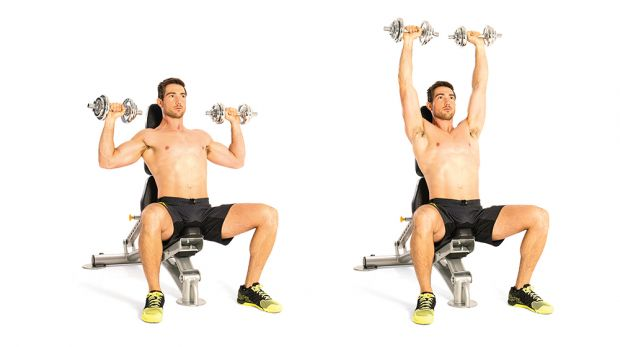 man performing a seated overhead dumbbell press
