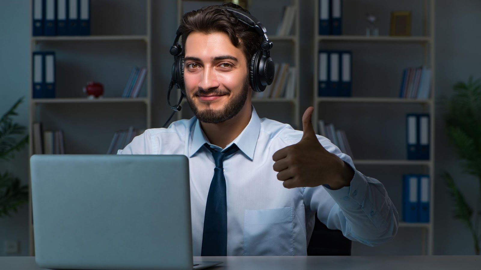 A call center outsourcing representative showing a thumbs up. 