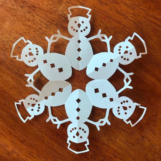 paper snowflakes in shape of snowmen