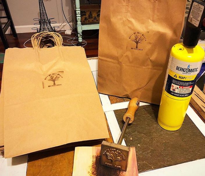 Brown paper bags marked with a branding iron