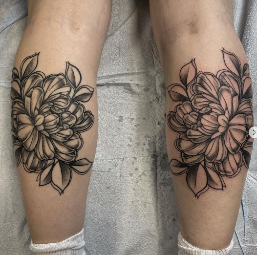 grey flower tattoo for leg