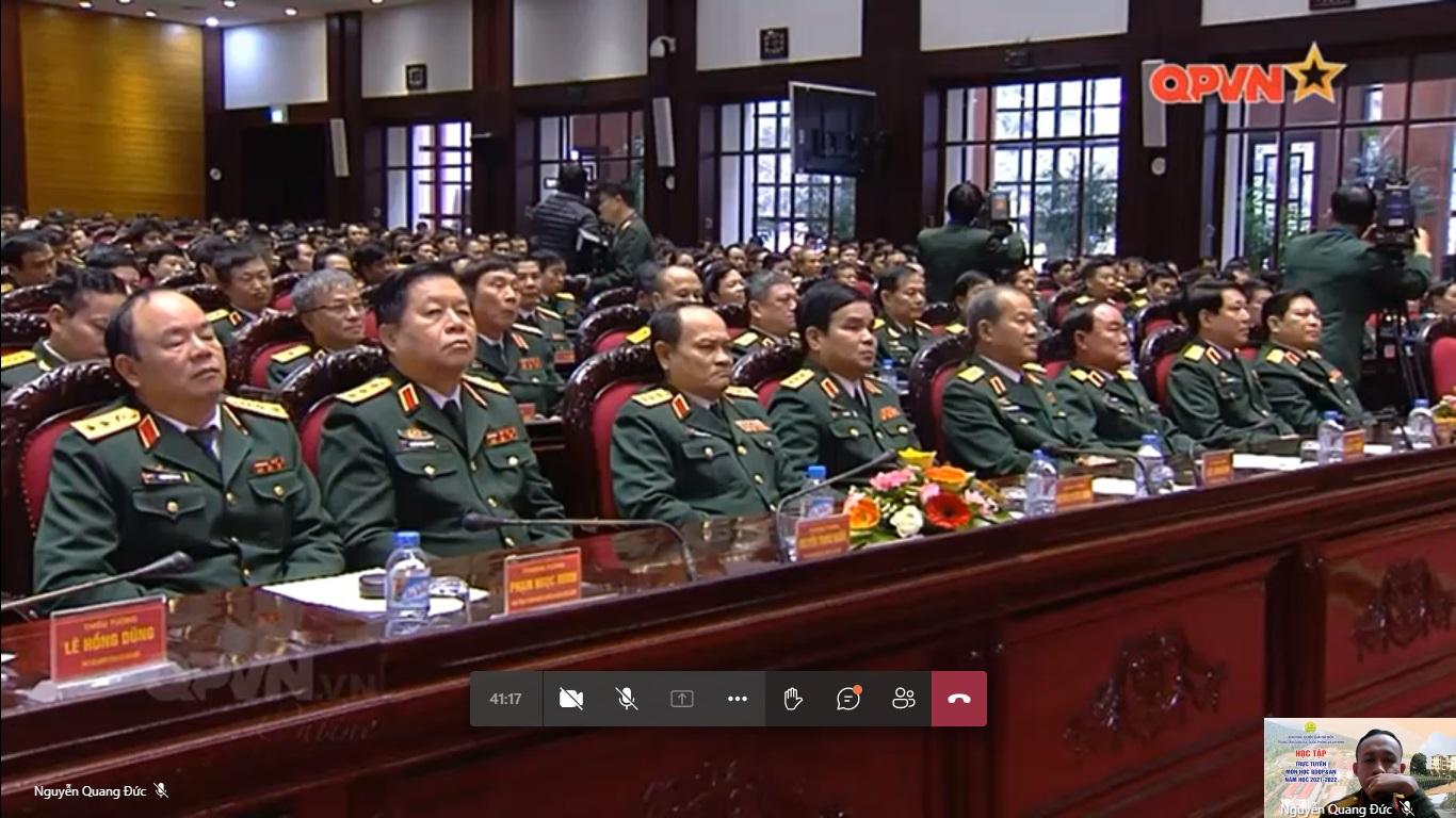A group of people in uniform sitting at a table</p>
<p>Description automatically generated with low confidence