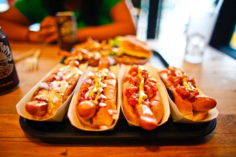 Several hot dogs on a plate.