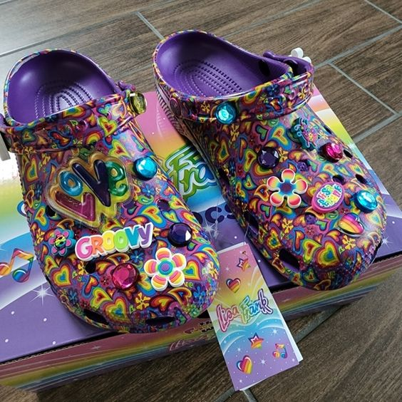 A pair of lisa frank crocs looking stylish