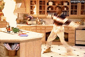 Will Smith from The Fresh Prince of Bel-Air kicking the air by a flaming pot.