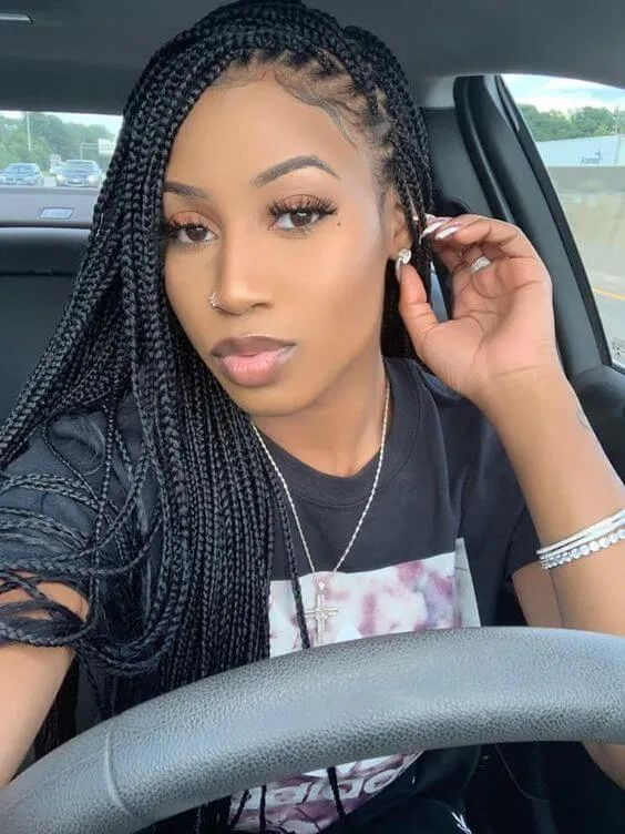 Gorgeous lady rocks small box braids in a side swept look