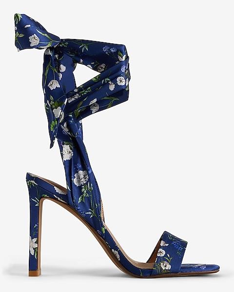 A blue high heel shoe with a bow

Description automatically generated with low confidence