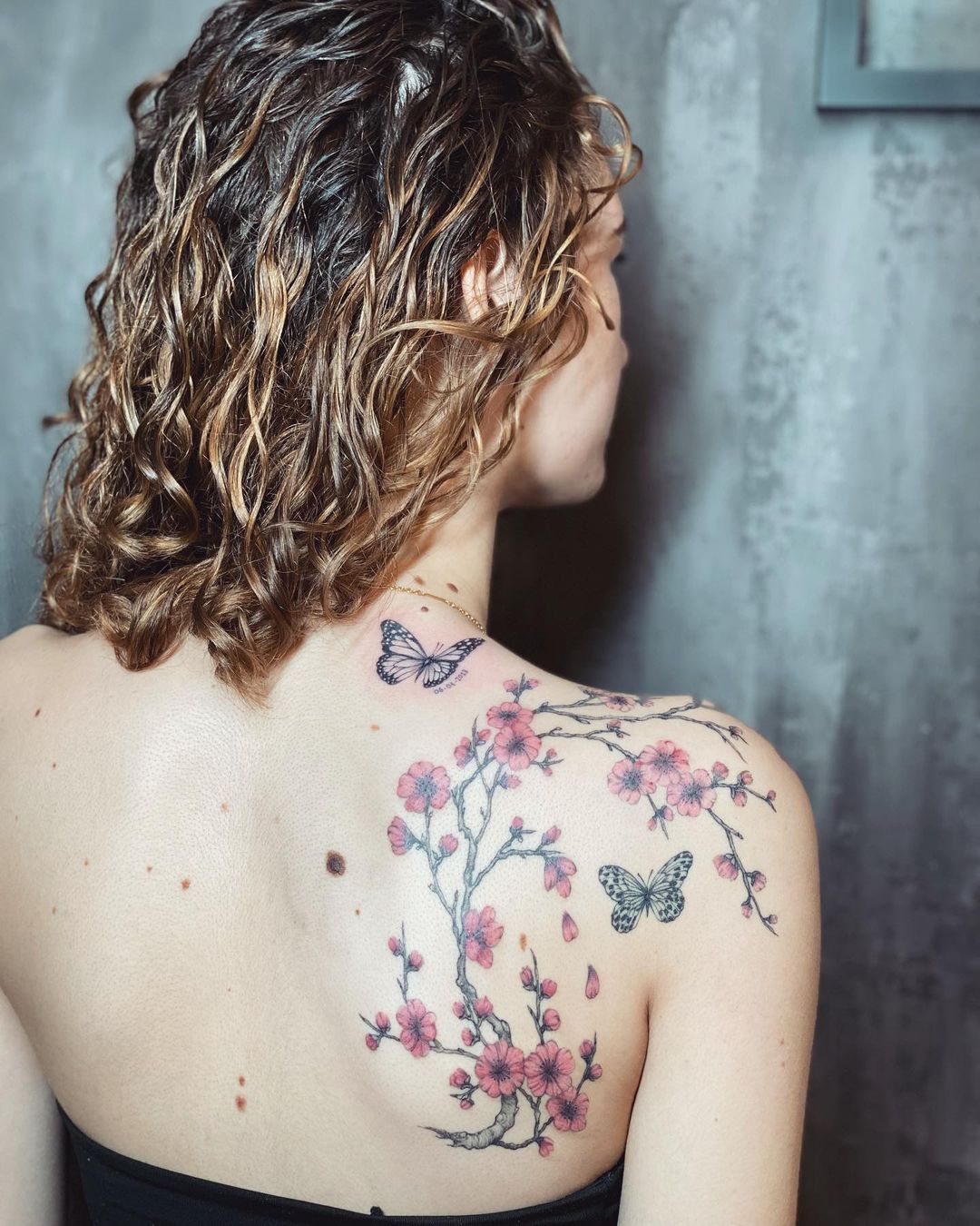 Pink Flower Tattoo On Back Shoulder