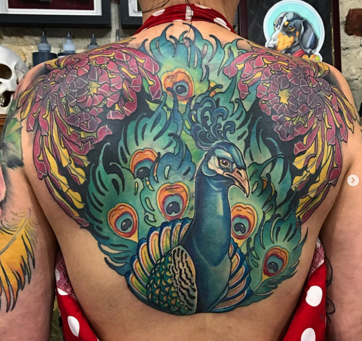 24. Tribal Peacock Tattoo On The Back