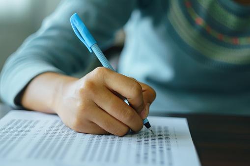 https://media.istockphoto.com/photos/college-student-write-on-exam-paper-picture-id968416412?b=1&k=6&m=968416412&s=170667a&w=0&h=vIhVTUueW1LiZlNmicxiDoRogzWJjjQrt_m5oBcD0uw=