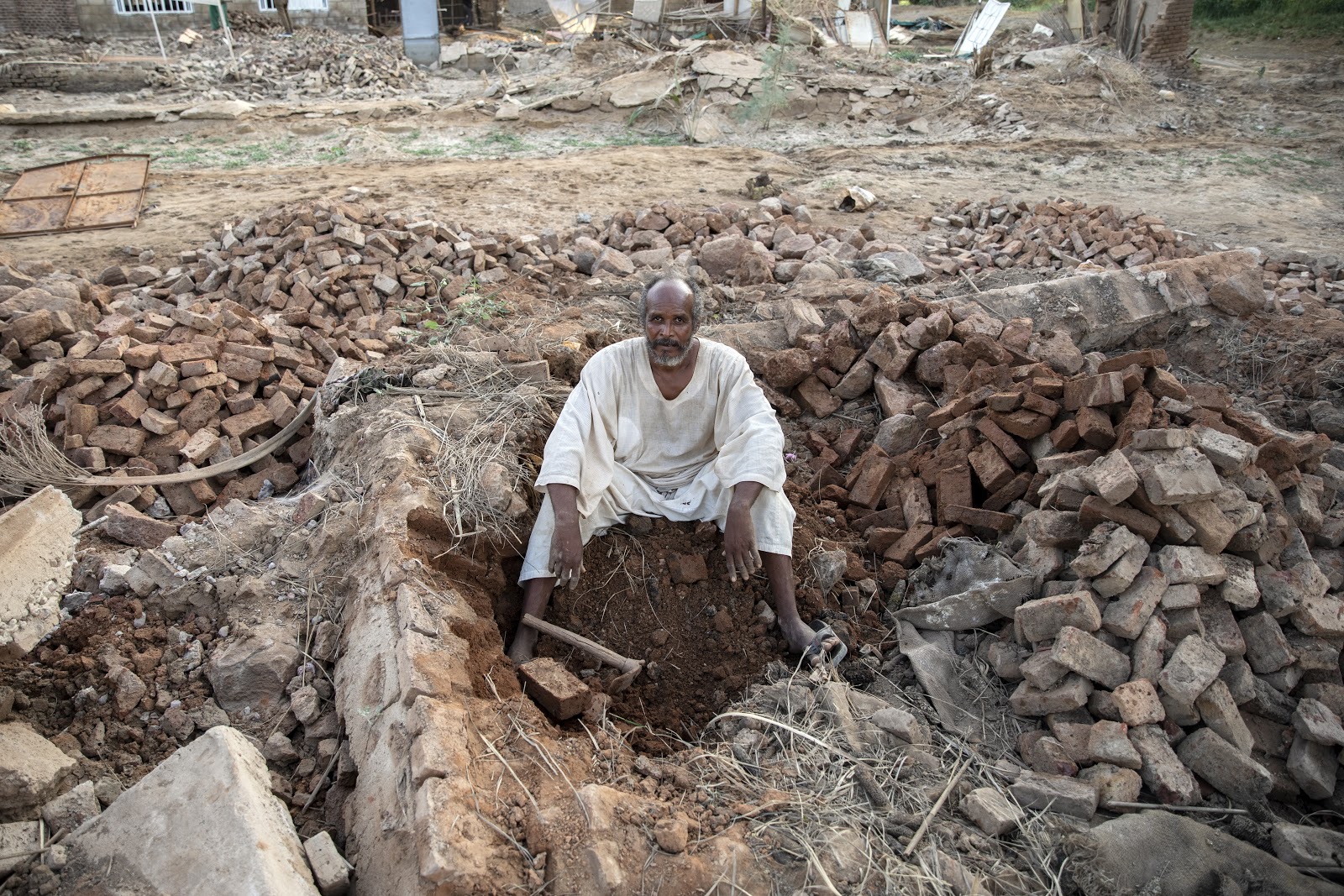 Khalafallah Gaballah in his destroyed house in Wad Ramly village