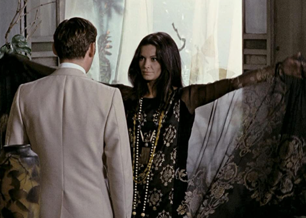 Florida Bolkan with raised arms in a scene from ‘Investigation of a Citizen Above Suspicion’
