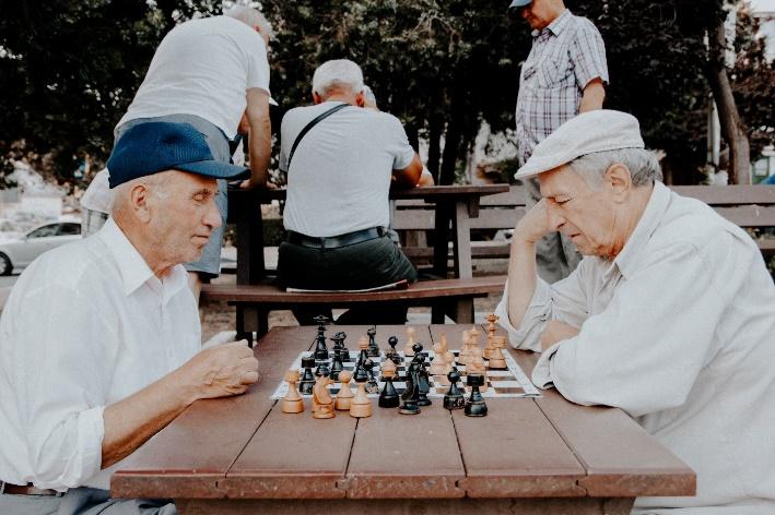 A group of men playing chess

Description automatically generated with medium confidence