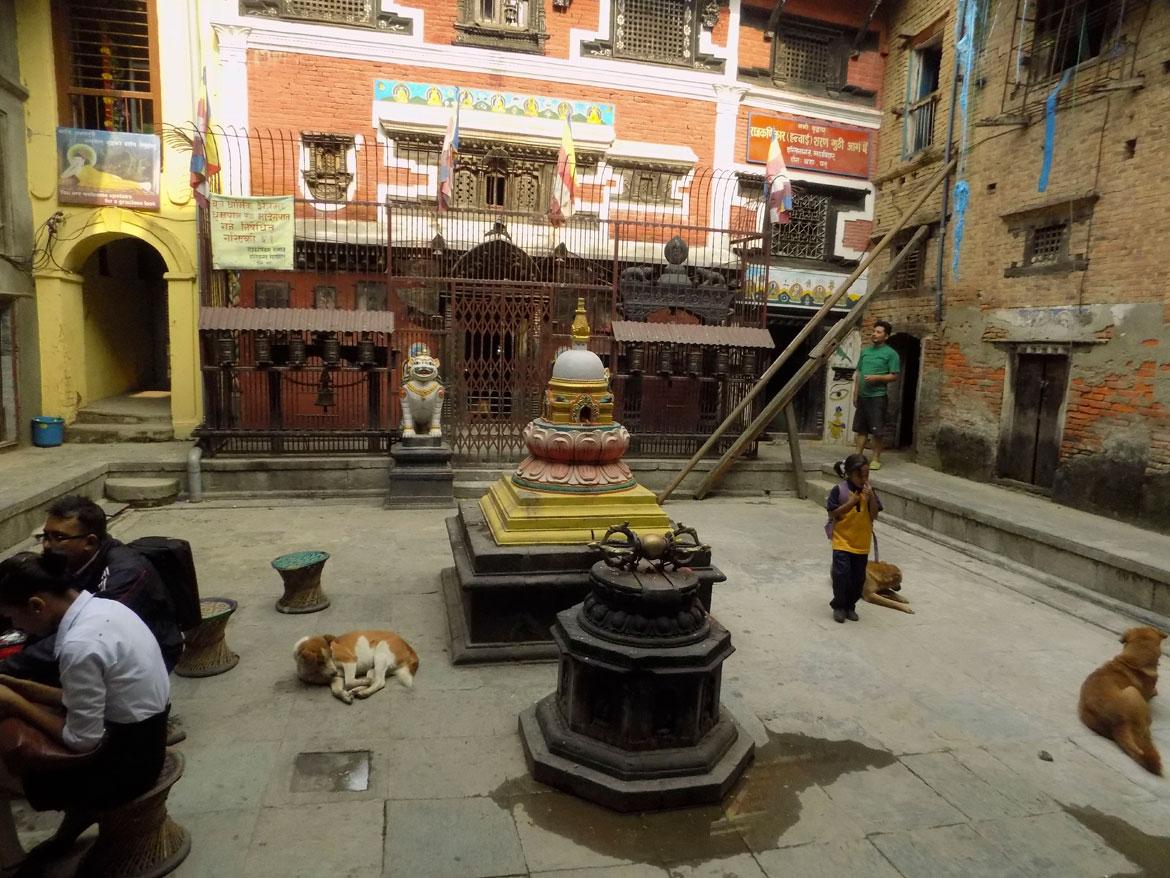 A stone's throw away from the Durbar Square are the Buddhist courtyards of the Mangah neighbourhood. Most of them have a common space surrounded by houses. The courtyards are secular spaces, but they also function as the immediate sacred site for the people of the neighbourhood, so you will find stupas, three-dimensional mandalas and the sacred vajra, along with a shrine to the Buddha in even the most basic courtyard