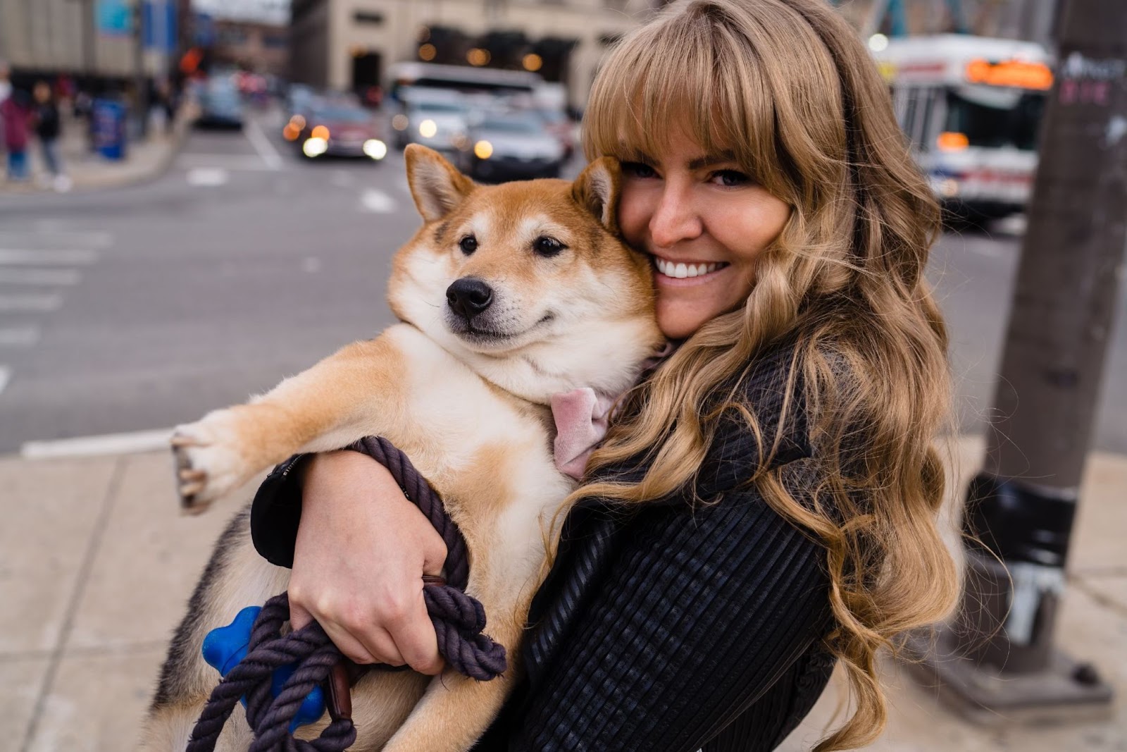 Ashley Piomelli holds her puppy close 