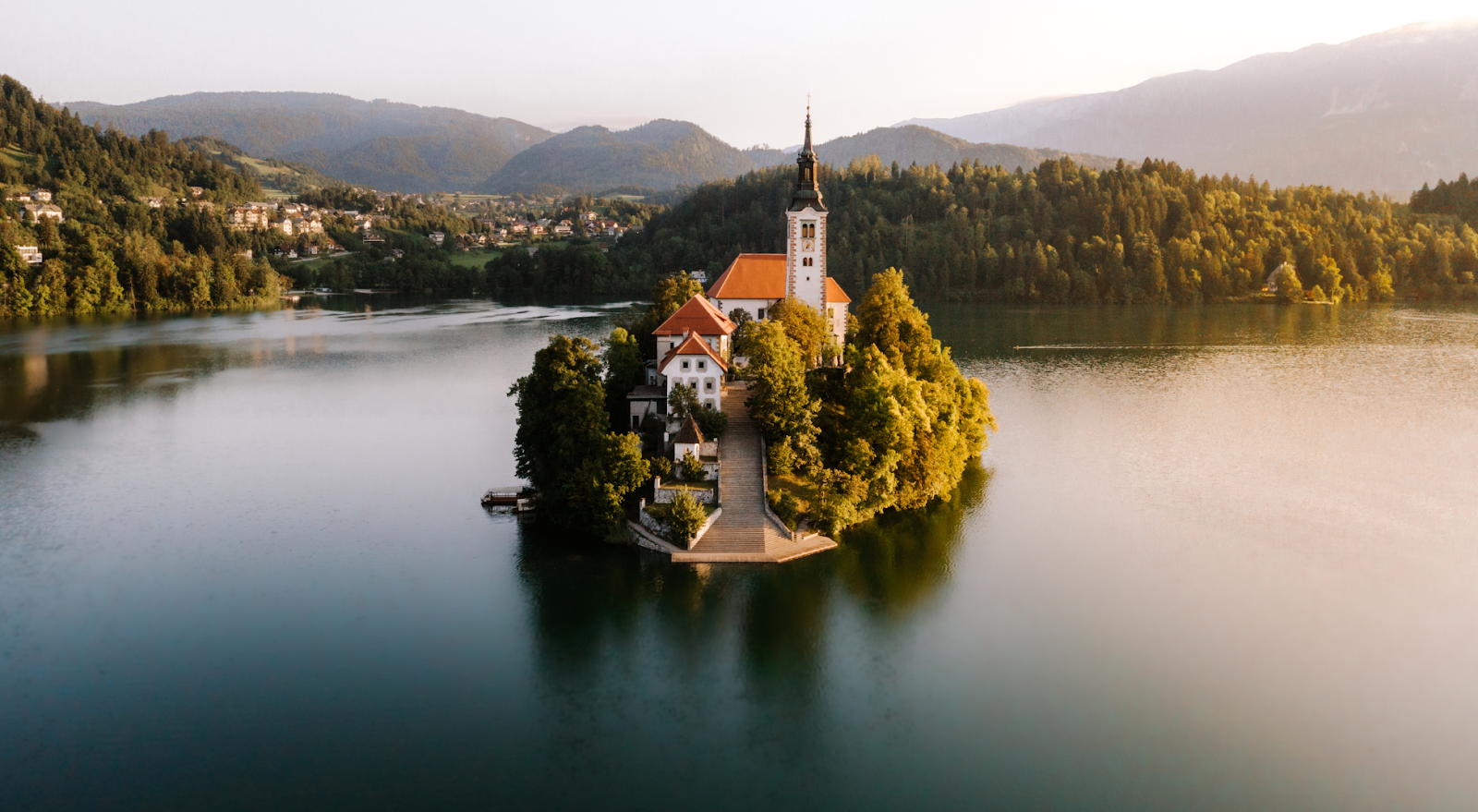 A to Z Bucket List - island with bell tower in the middle of serene Lake Bled
