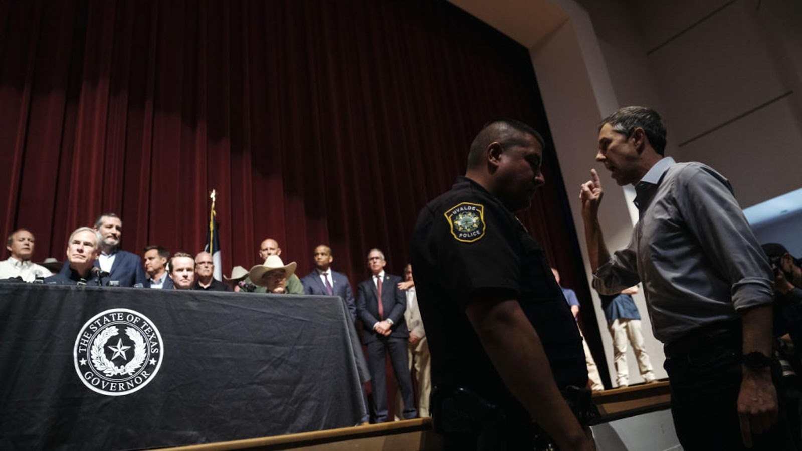 Beto O'Rourke, Democratic gubernatorial candidate for Texas, right, confronts Greg Abbott, governor of Texas, during a news conference in Uvalde, Texas, US, on Wednesday, May 25, 2022. President Joe Biden mourned the killing of at least 19 children and two teachers in a mass shooting at a Texas elementary school on Tuesday, decrying their deaths as senseless and demanding action to try to curb the violence. Photographer: Eric Thayer/Bloomberg via Getty Images