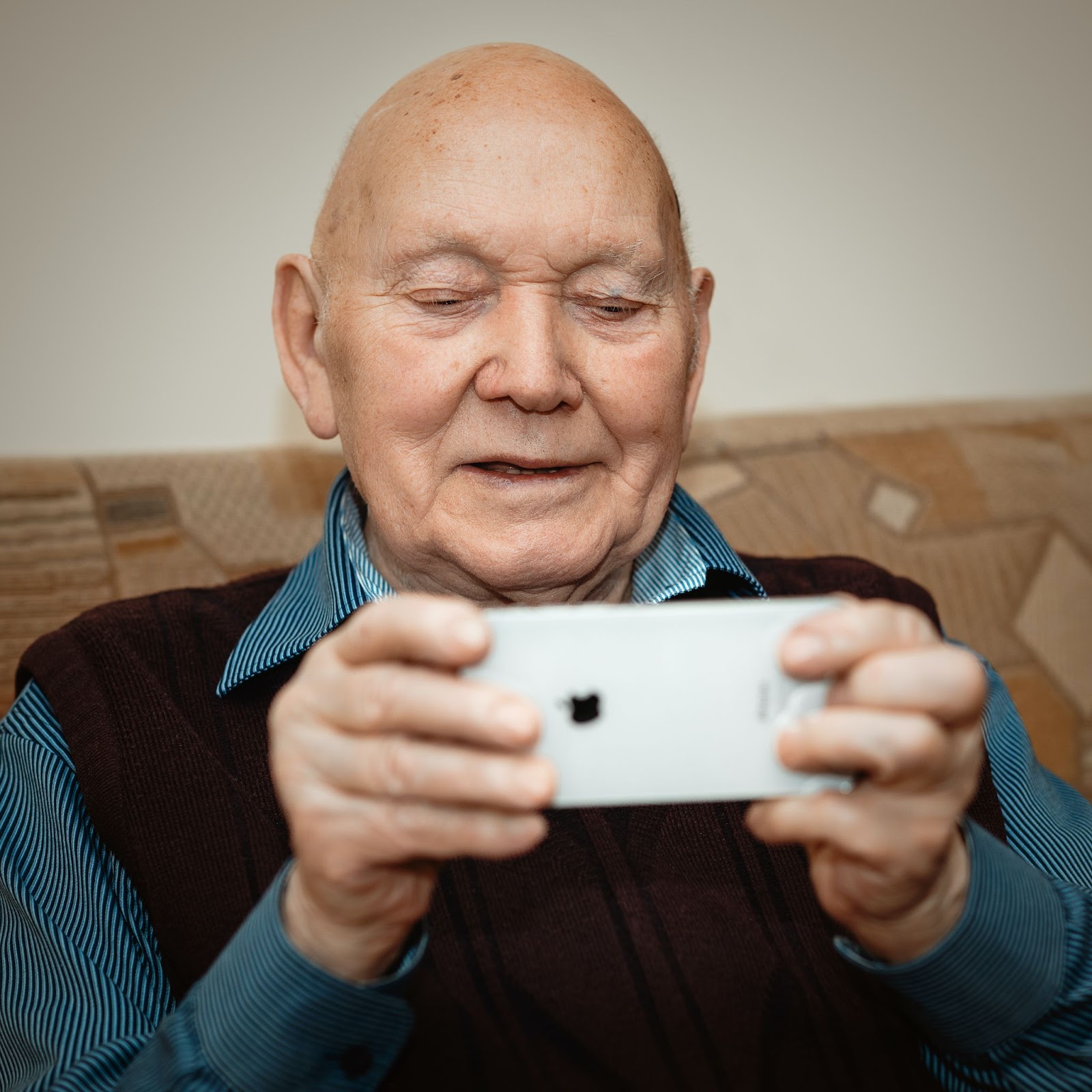 Old man playing video game