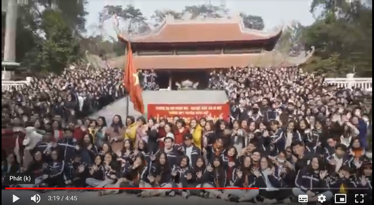 A large group of people in front of a stage</p> <p>Description automatically generated with medium confidence