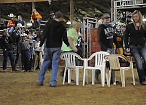 A GIF that shows adults fighting to win musical chairs. 