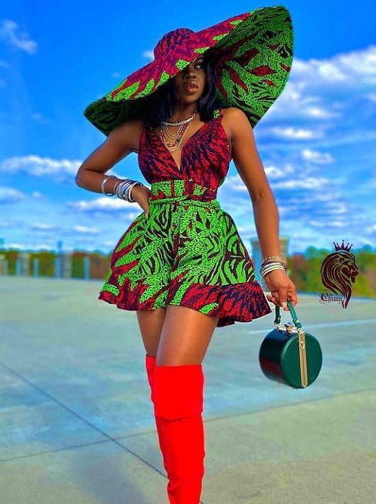 Woman in wide-brimmed Ankara hat and playsuit