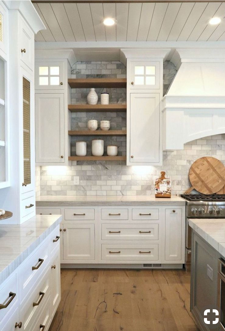 kitchen featuring white shaker cabinets, light wood floors, grey subway tile backsplash, open shelving, brass hardware and shiplap ceiling